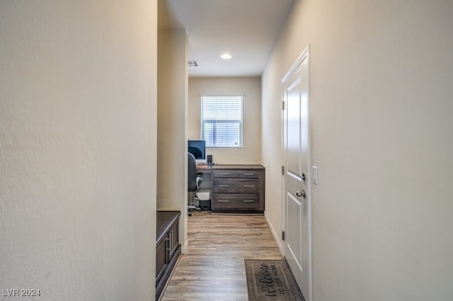 hall with light hardwood / wood-style flooring