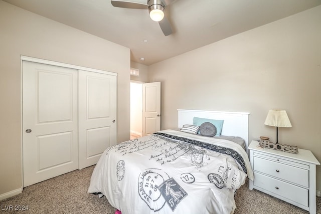 carpeted bedroom featuring a closet and ceiling fan