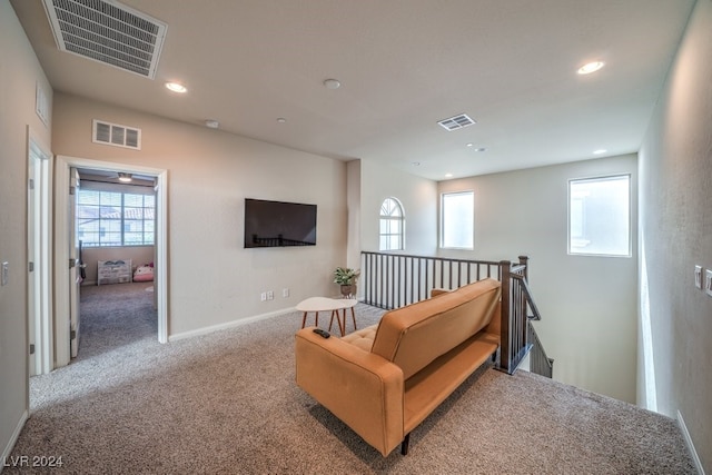 living area with light colored carpet