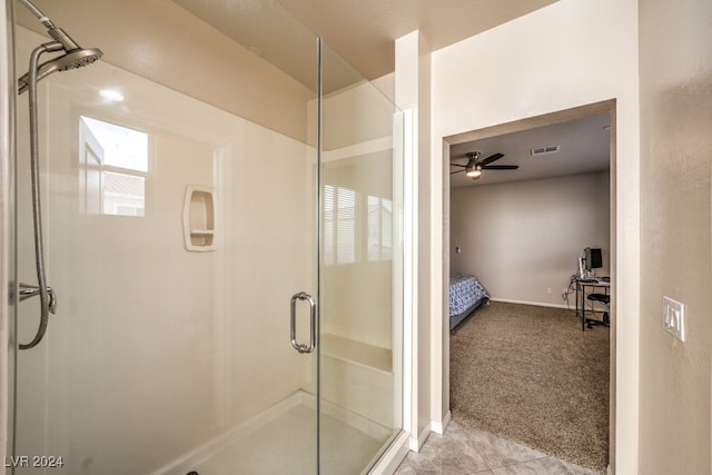 bathroom featuring walk in shower and ceiling fan