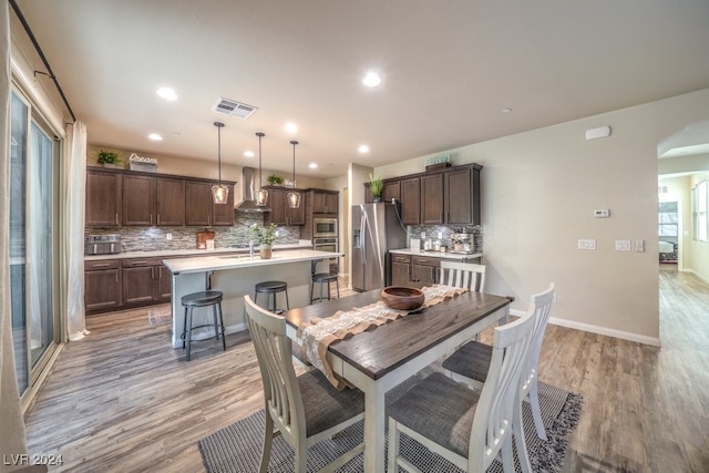 dining room featuring light hardwood / wood-style flooring