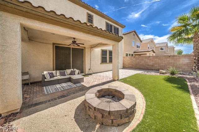 view of patio / terrace featuring an outdoor living space with a fire pit and ceiling fan