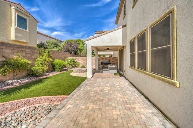 view of patio with ceiling fan