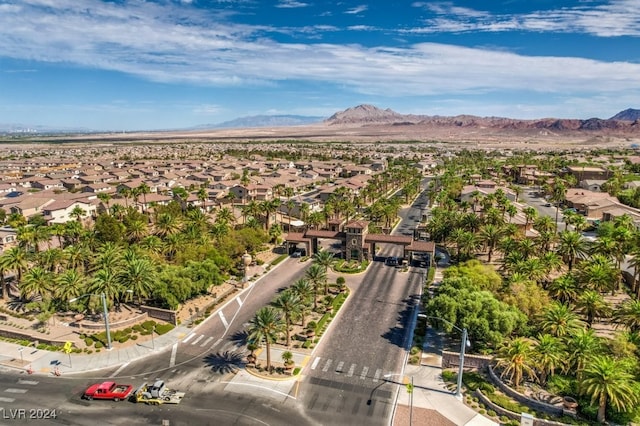 birds eye view of property with a mountain view