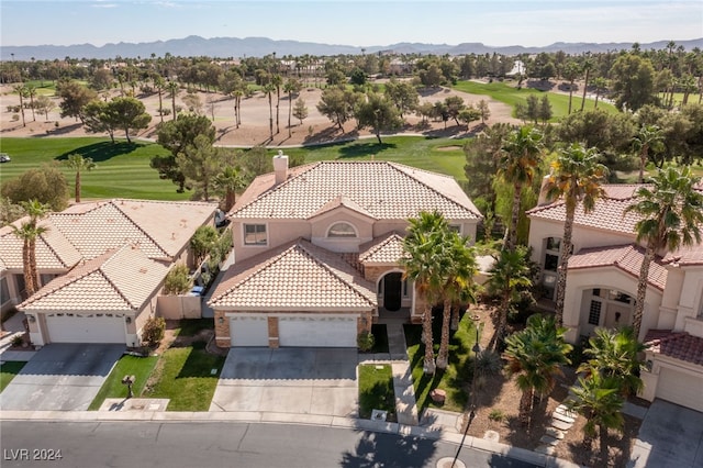 birds eye view of property with a mountain view