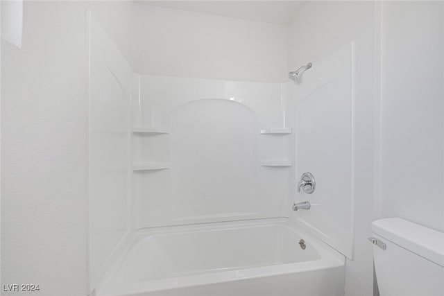 bathroom with toilet and shower / washtub combination