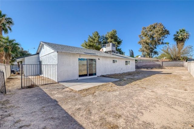 back of property with a patio