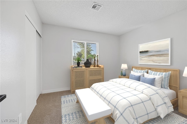 carpeted bedroom featuring a closet and a textured ceiling