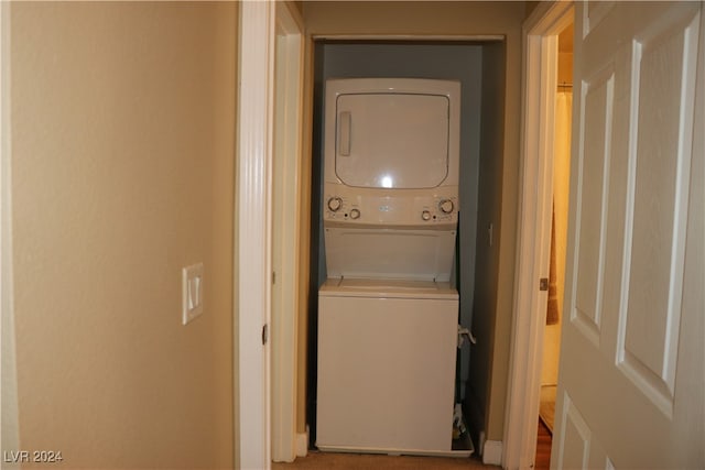 laundry area with stacked washer / dryer