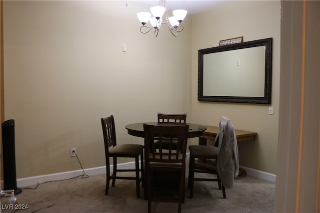 dining room with an inviting chandelier and carpet flooring