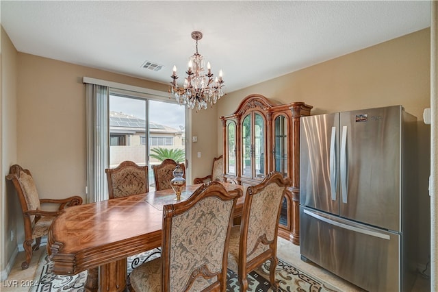 dining space with a notable chandelier