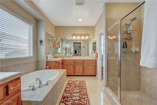 bathroom with vanity, separate shower and tub, and tile patterned flooring