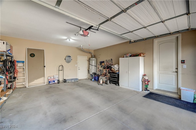 garage featuring a garage door opener and strapped water heater