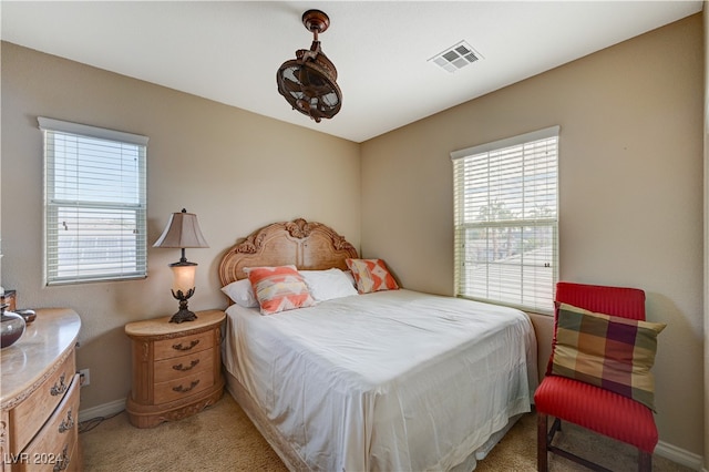 bedroom with light carpet