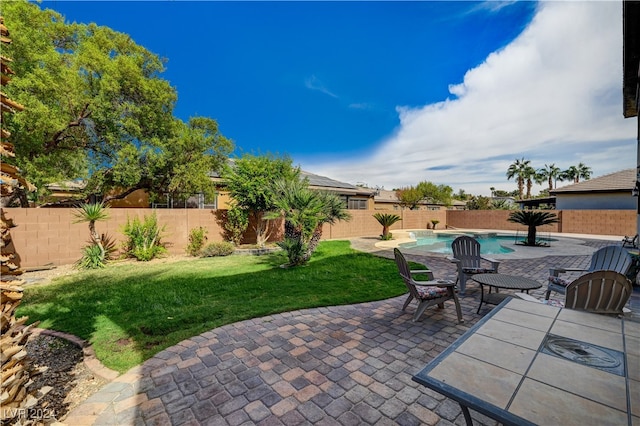 view of patio / terrace with a fenced in pool