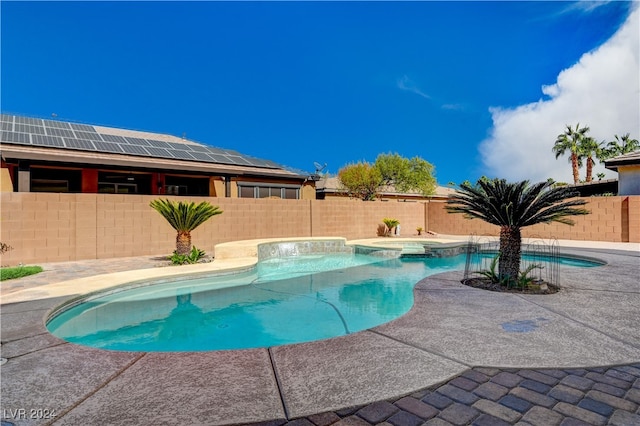 view of swimming pool with an in ground hot tub and a patio