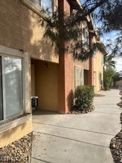 view of side of home with a patio area