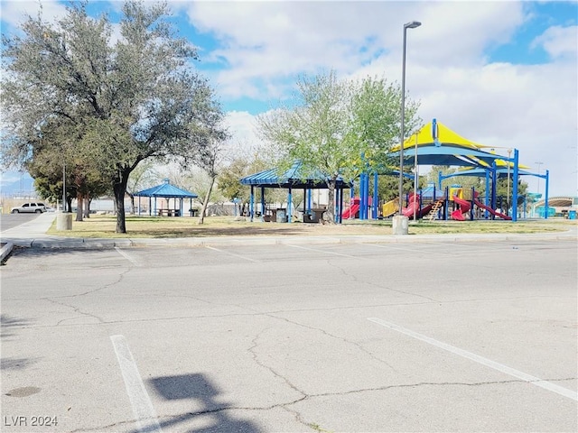 view of street featuring curbs, street lighting, and sidewalks