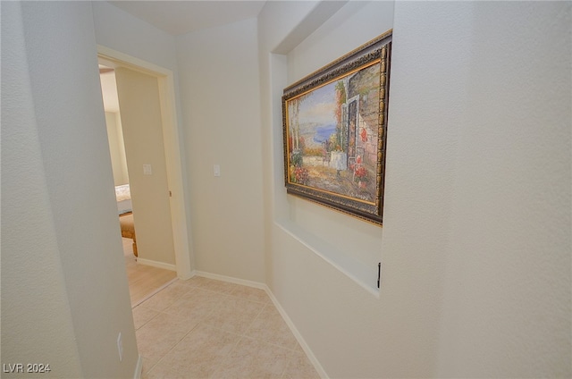 hallway featuring light tile patterned floors