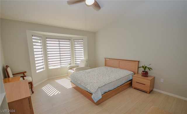 bedroom with light hardwood / wood-style floors and ceiling fan