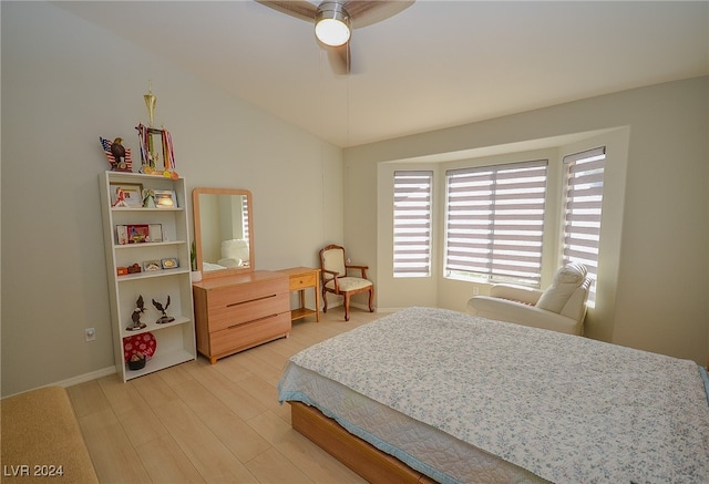 bedroom with light wood-type flooring, ceiling fan, and lofted ceiling