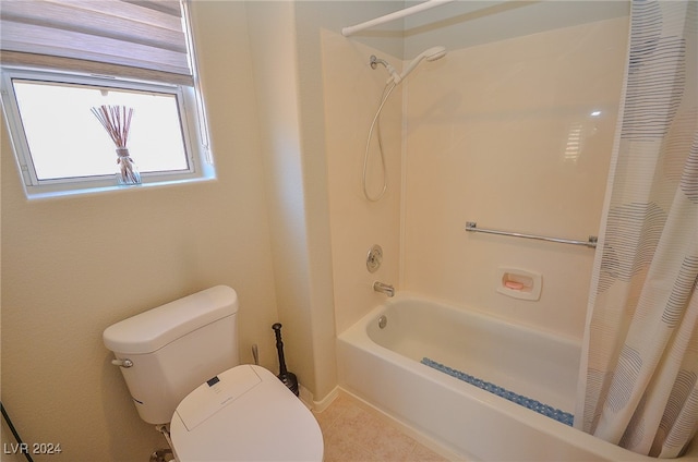 bathroom featuring toilet and shower / tub combo with curtain