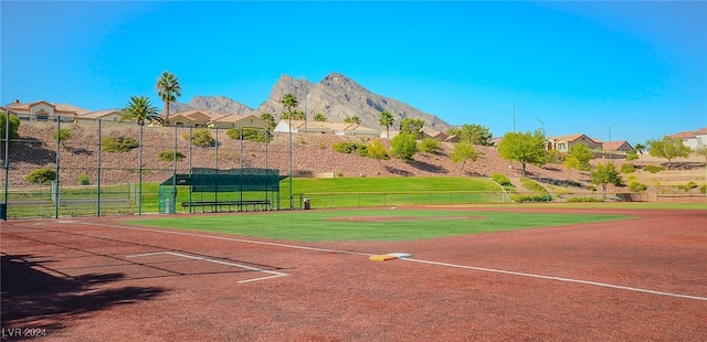 view of property's community with a yard and a mountain view