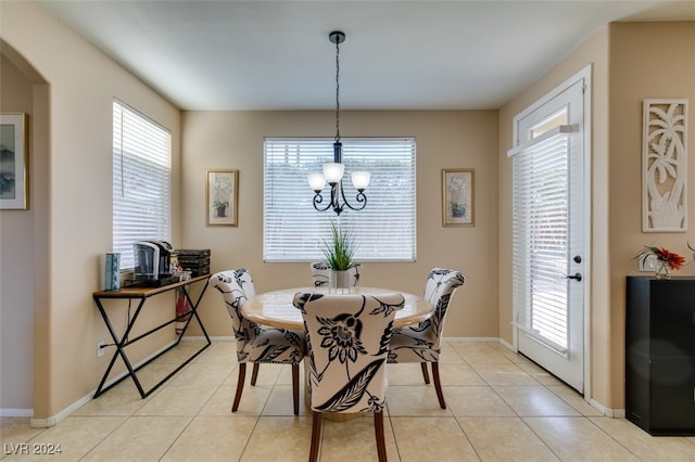 dining area featuring plenty of natural light and light tile patterned floors