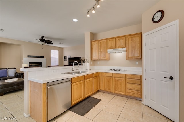 kitchen featuring light tile patterned flooring, kitchen peninsula, sink, and dishwasher