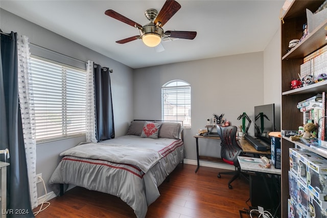 bedroom featuring ceiling fan and dark wood-type flooring