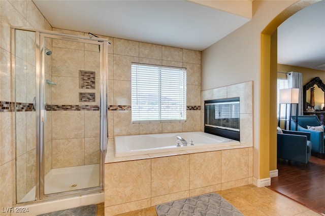 bathroom with wood-type flooring and separate shower and tub