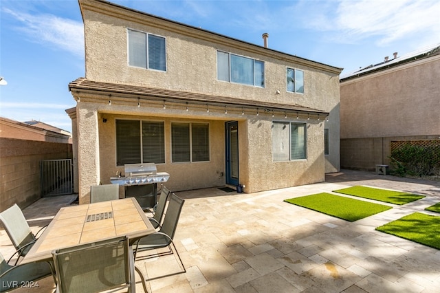 back of property with a patio area