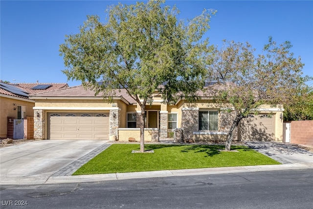 view of front of house with a front lawn and a garage