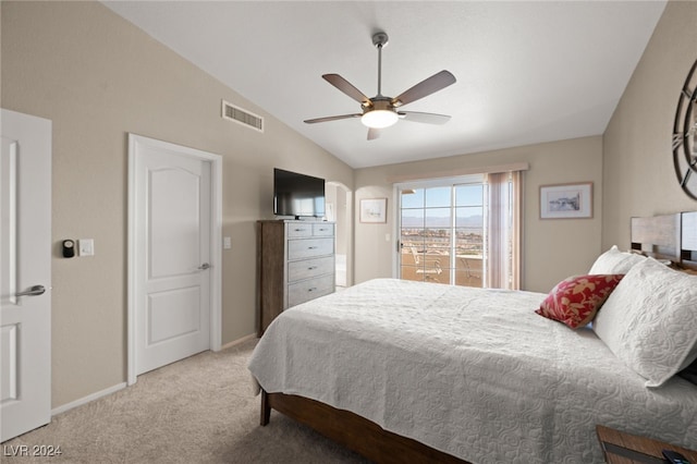 bedroom featuring carpet floors, vaulted ceiling, and ceiling fan