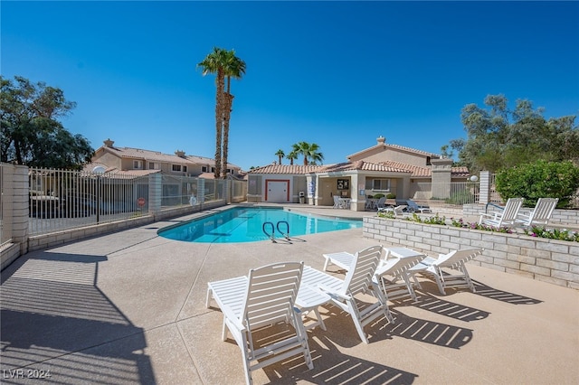 view of swimming pool featuring a patio