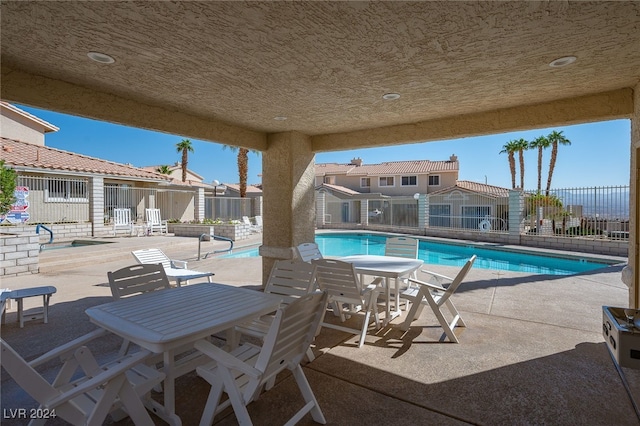 view of swimming pool with a patio