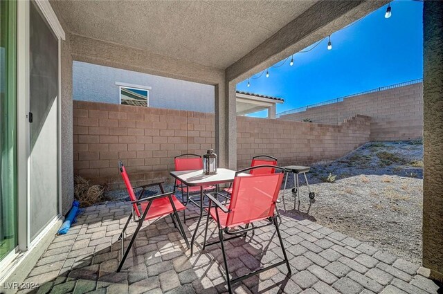 view of patio with a fenced backyard and outdoor dining space