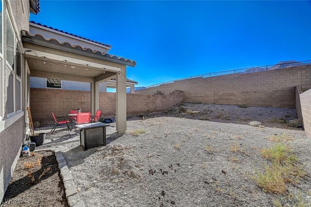 view of yard featuring a patio and a fenced backyard