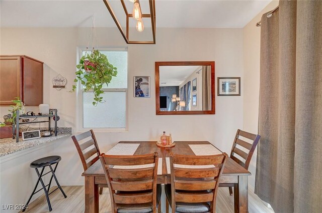 dining space with light wood-type flooring