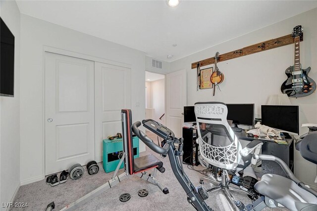 workout room with visible vents, baseboards, and carpet flooring