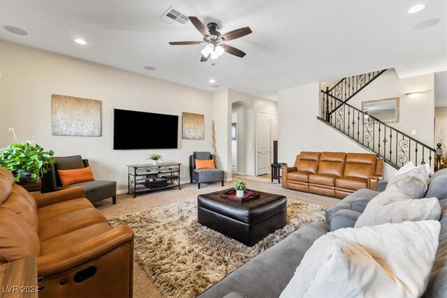 living room with carpet floors and ceiling fan