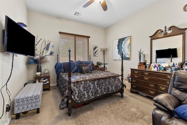 bedroom featuring light colored carpet and ceiling fan