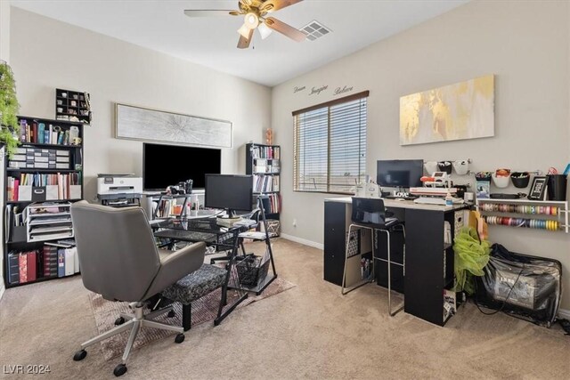 carpeted office featuring ceiling fan