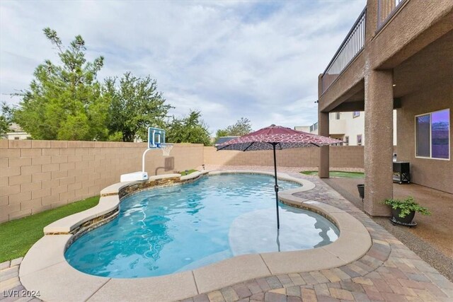 view of pool featuring a patio area