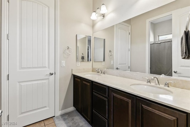 bathroom with tile patterned floors, vanity, and a shower with shower curtain