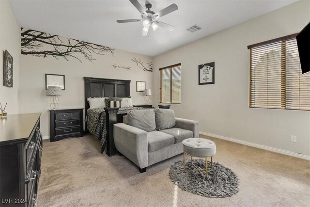 bedroom featuring ceiling fan, carpet flooring, and multiple windows