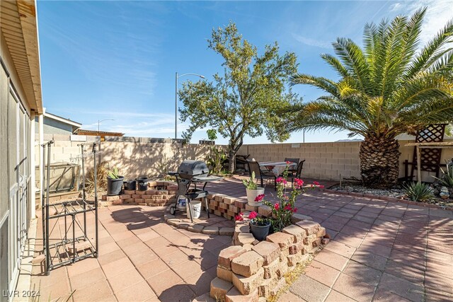 view of patio with a grill