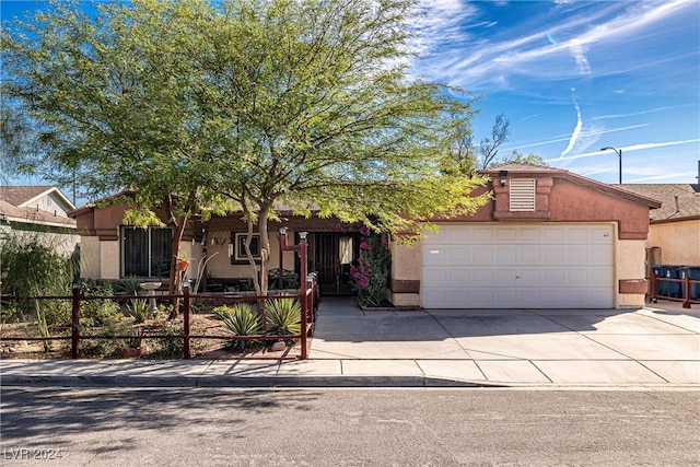 view of front of property with a garage