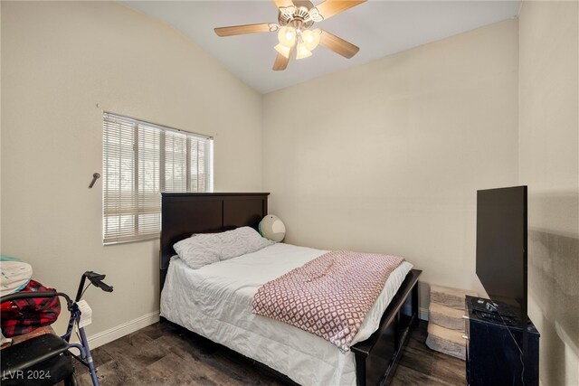 bedroom featuring ceiling fan, lofted ceiling, and dark hardwood / wood-style floors