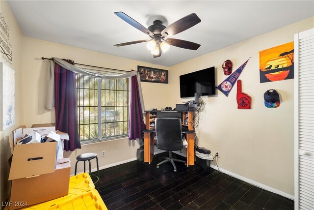 office with dark hardwood / wood-style floors and ceiling fan